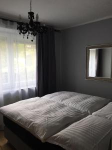 Ein Bett oder Betten in einem Zimmer der Unterkunft Enjoyit-WS