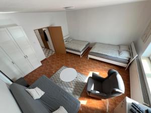 a small room with a couch and a bed at Home4you Katowice, Free Parking, Self Check-in in Katowice