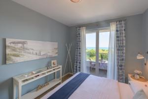 Postel nebo postele na pokoji v ubytování Apartment BLUE LAGOON + 21 fotografií