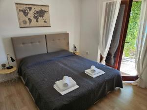 Posteľ alebo postele v izbe v ubytovaní Apartmani Sandra i Davor Lonic