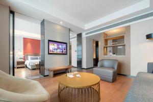 Posezení v ubytování Mansion New Century Hotel Chengdu Wuhou