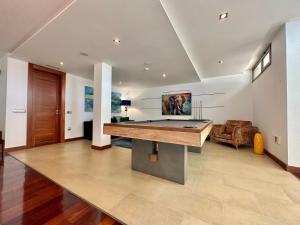 a large living room with a pool table in it at Villa Deluxe - Jardin del Mar y Cielo in Tacoronte +46 photos