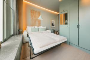 Ένα ή περισσότερα κρεβάτια σε δωμάτιο στο Spacious & Cozy Studio Apartment