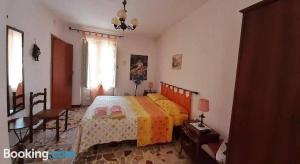 Кровать или кровати в номере Keope casa scrittori e artisti