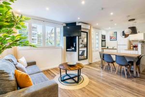 a living room with a couch and a table at Cassis Le Marignan in Cassis +12 photos