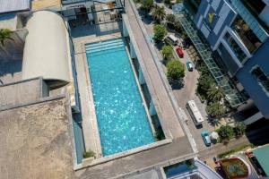 an overhead view of a swimming pool on a building at Rembrandt Hotel Nha Trang in Nha Trang