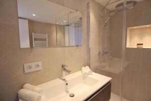 a bathroom with a sink and a shower at Luxury 2bedrms with SeaView CityCenter&Parking #4 in Roquebrune-Cap-Martin +19 photos