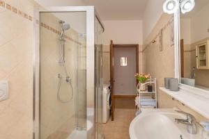 a bathroom with a shower and a sink at Casa Baldi Lajatico in Laiatico +26 photos