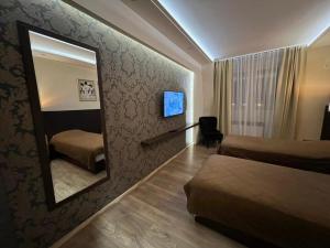 Voodi või voodid majutusasutuse Hotel Petrus toas