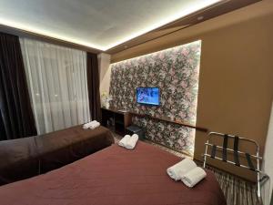 Voodi või voodid majutusasutuse Hotel Petrus toas