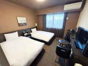 TV a/nebo společenská místnost v ubytování Hotel Route Inn Osaka Izumi -Kishiwada Izumi Inter-