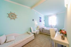 a living room with two beds and a couch at Il Timone in Santa Margherita Ligure