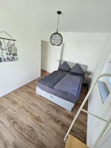 Postel nebo postele na pokoji v ubytování Exklusive COZY 3-Zi-Penthouse mit großer Dachterrasse Nähe Europa Park und Rulantica