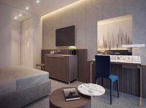 Kuchyň nebo kuchyňský kout v ubytování Grand Rosewood Near Delhi International Airport