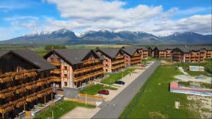 an aerial view of a resort with mountains in the background at TRITA SK - Apartmán Tatragolf C303 in Veľká Lomnica