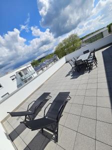 Balkón nebo terasa v ubytování Exklusive COZY 3-Zi-Penthouse mit großer Dachterrasse Nähe Europa Park und Rulantica