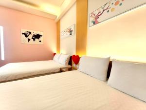 Una cama o camas en una habitación de 日晴民宿 Sun Day