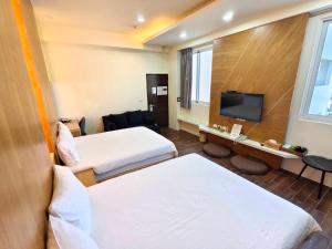 Una cama o camas en una habitación de 日晴民宿 Sun Day