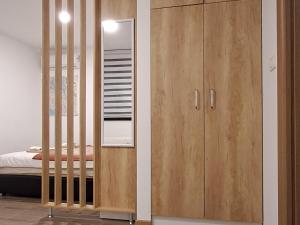 Postel nebo postele na pokoji v ubytování Studio apartman "Kutak DIVUS"