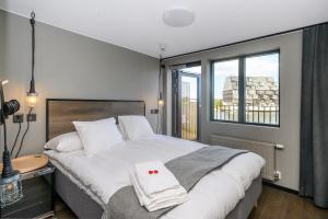 Postel nebo postele na pokoji v ubytování Blomlöfs Hotell Saltö
