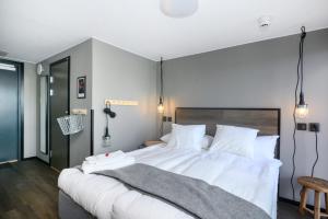 Voodi või voodid majutusasutuse Blomlöfs Hotell Saltö toas