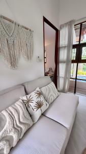 a white couch with pillows on it in a room at Villa La Golden Monkey, Villa 24 in Chaweng Noi Beach +10 photos