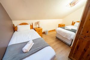 Letto o letti in una camera di Aras Ghleann Cholm Cille