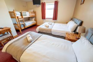 Letto o letti in una camera di Aras Ghleann Cholm Cille