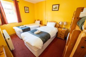 Letto o letti in una camera di Aras Ghleann Cholm Cille