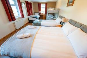 Letto o letti in una camera di Aras Ghleann Cholm Cille
