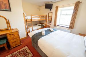 Letto o letti in una camera di Aras Ghleann Cholm Cille