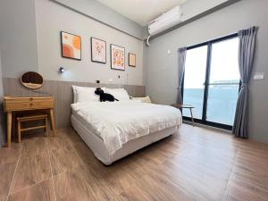 Cama o camas de una habitación en Manman Homestay