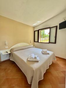 Postel nebo postele na pokoji v ubytování Cilento Dreams Village + 37 fotografií