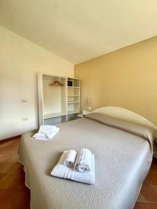 Postel nebo postele na pokoji v ubytování Cilento Dreams Village