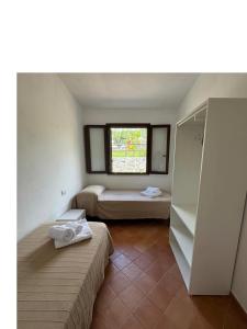 Postel nebo postele na pokoji v ubytování Cilento Dreams Village