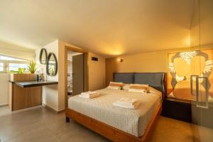 a bedroom with a large bed in a room at Jarko Luxury Houses in Argoulidhés