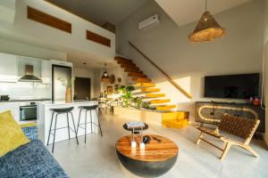 a living room with a couch and a table at Jarko Luxury Houses in Argoulidhés