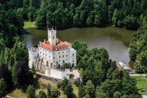 an aerial view of a castle in a lake at Old house by the stream in Donja Stubica