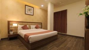 Cama ou camas em um quarto em Hotel Shiv Shakti
