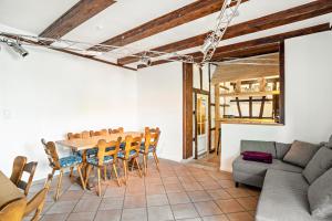 a living room with a table and chairs and a couch at Ferienhaus St Georg Stube in Grömbach