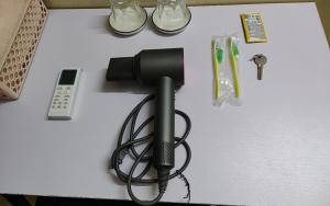 a black flashlight sitting on top of a table at WRX guest house in Hanoi