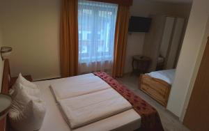 Ein Bett oder Betten in einem Zimmer der Unterkunft Hotel Beretta