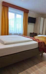 Ein Bett oder Betten in einem Zimmer der Unterkunft Hotel Beretta