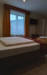 Ein Bett oder Betten in einem Zimmer der Unterkunft Hotel Beretta