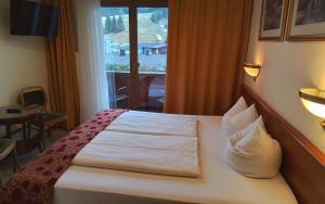 Ein Bett oder Betten in einem Zimmer der Unterkunft Hotel Beretta