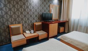 TV a/nebo společenská místnost v ubytování Hotel Concrete