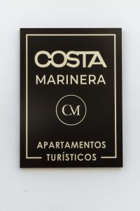 ein Schild mit der Aufschrift Costa Marignotaarma in der Unterkunft Un acogedor complejo compuesto de 5 apartamentos in Barbate