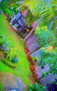 una pintura de un jardín con árboles y plantas en Nataliya, en Nikawatawana