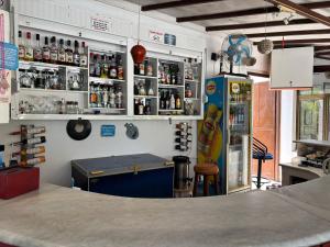 a kitchen with a counter and a refrigerator in a room at Ali Baba Hotel Gümbet in Gümbet