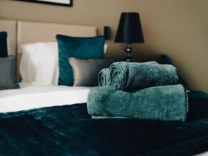 Ένα ή περισσότερα κρεβάτια σε δωμάτιο στο Artesia Tower +7 φωτογραφίες